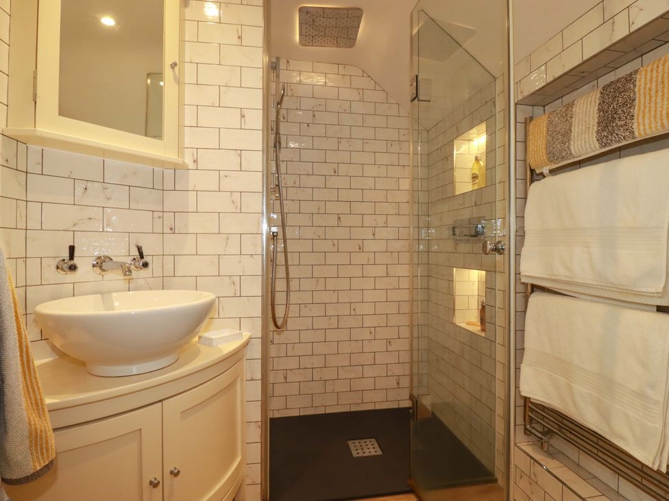 A bathroom with a sink and shower at Seveock in Threemilestone