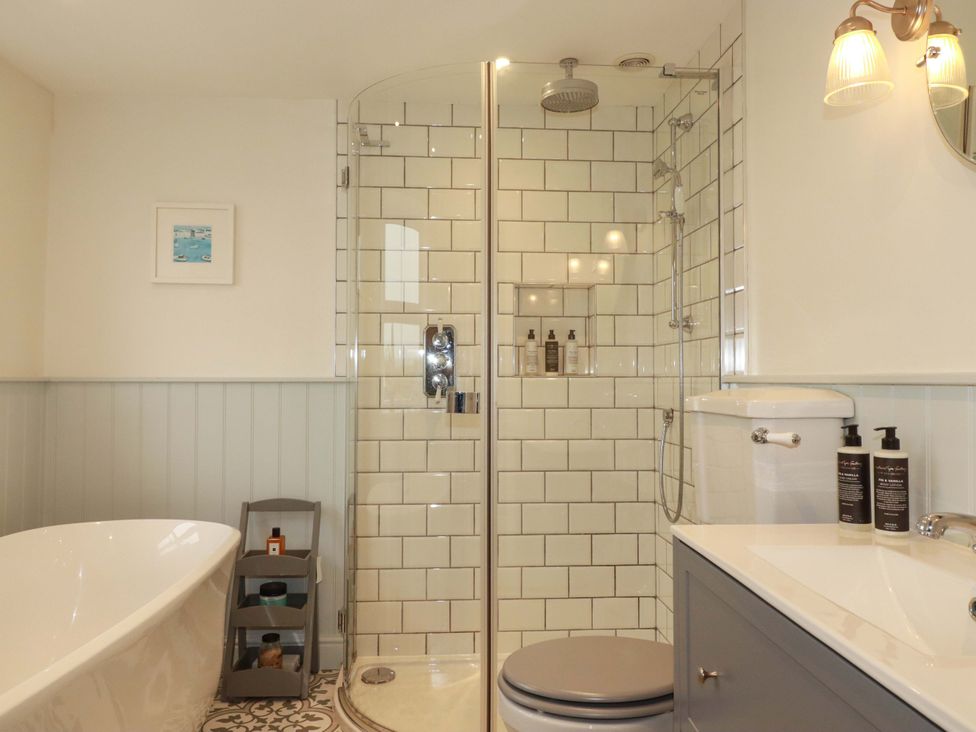 A bathroom with a bathtub and shower in Seveock Threemilestone