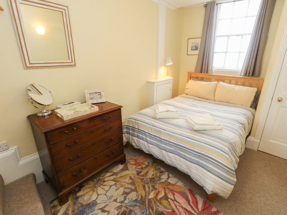 A bedroom with a bed and chest of drawers at No 3 By The Sea Weymouth