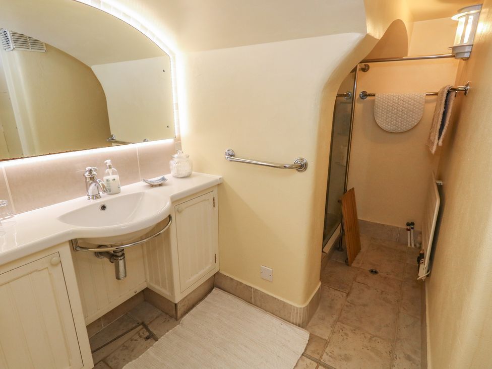 A bathroom with a sink and shower at No 3 By The Sea in Weymouth