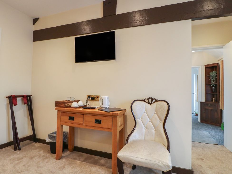 A guest room with a table and chair at Stay @ Mantra Stoke Albany