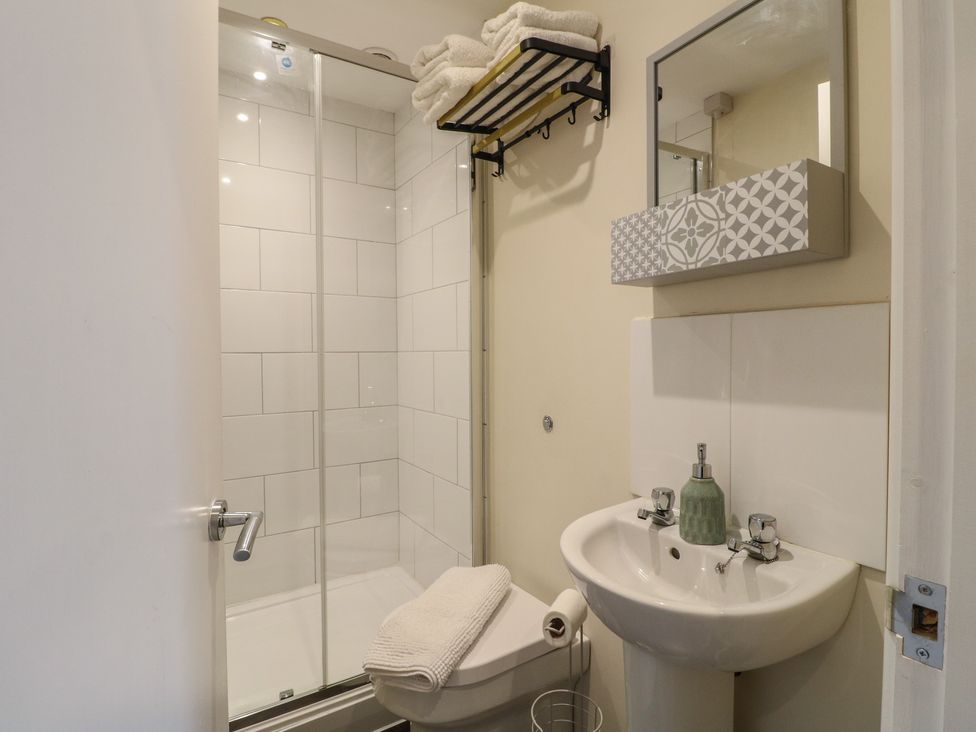 A bathroom with a shower and sink at Stay @ Mantra Stoke Albany
