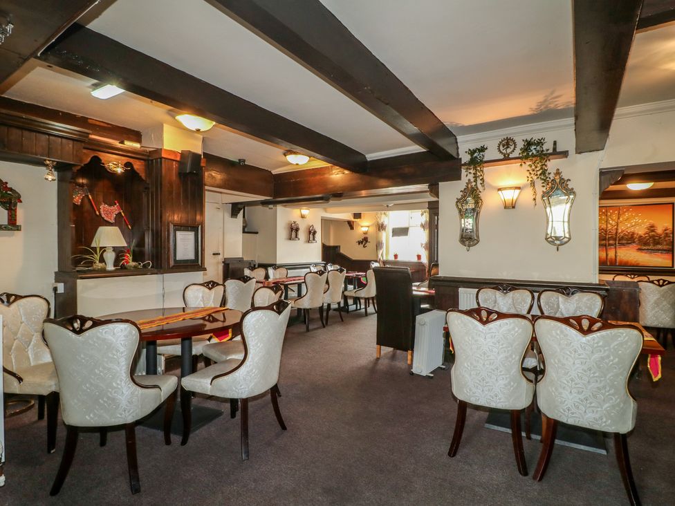 A dining room with tables and chairs at Stay @ Mantra Stoke Albany