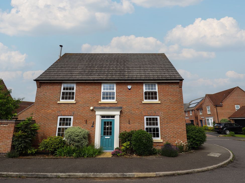 A house with a front garden and pathway at 26 Otho Way