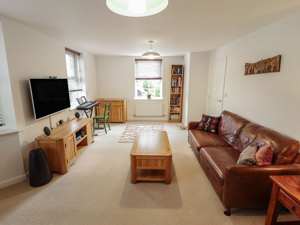 A living room with furniture and a television at 26 Otho Way