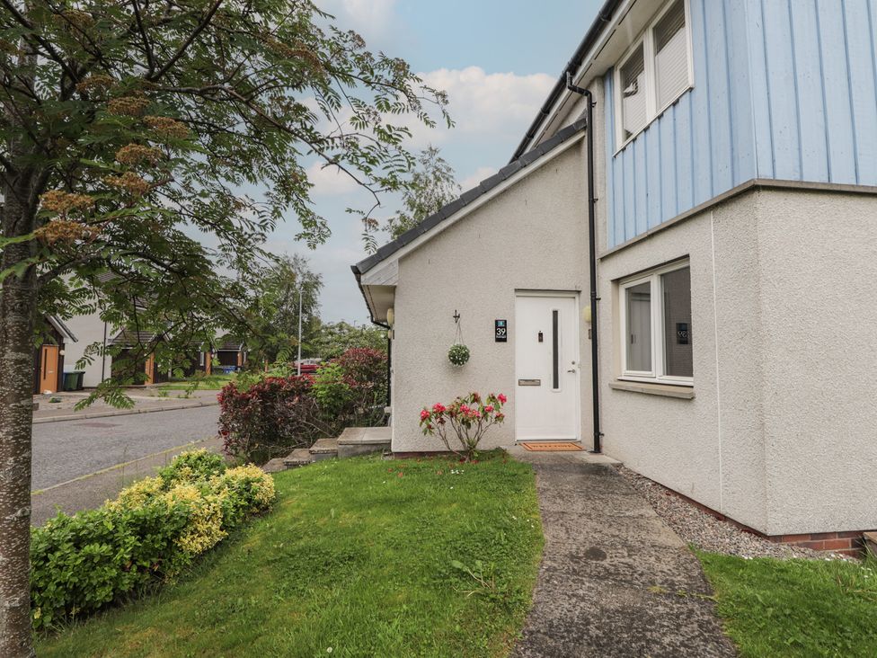 A house with a front door and pathway at 39 Knocknagael Inverness