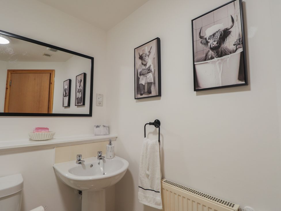 A bathroom with a sink and toilet at 39 Knocknagael in Inverness