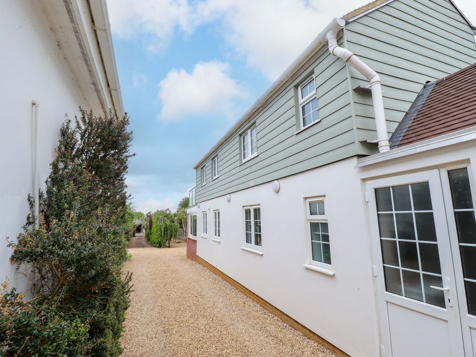 An outdoor view of a house with gravel pathway at The Hen House 