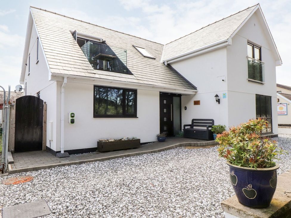 A house exterior with a front door and garden at Seagull Shack Morfa Bychan
