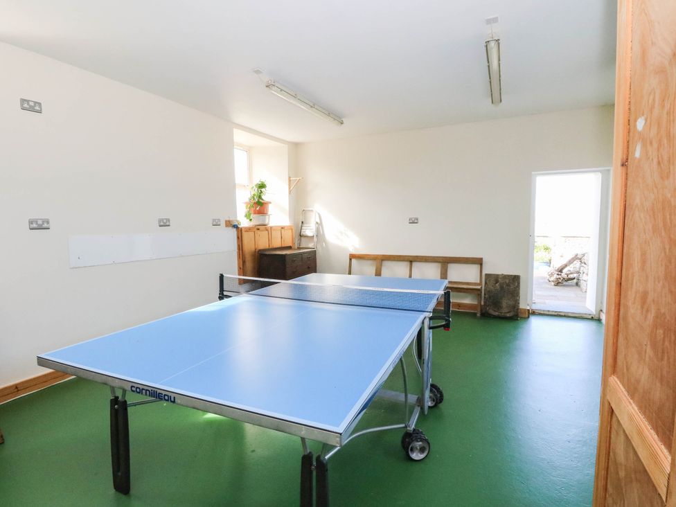 A games room with a ping pong table at The Old School House Isle Of South Uist