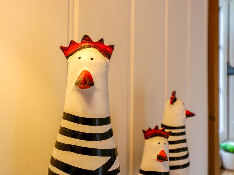 Three chicken figurines with striped design at The kestrel in Cambridge