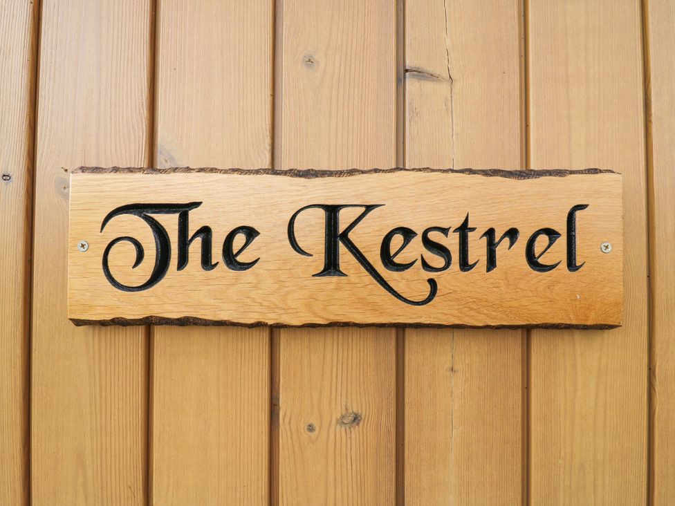 A wooden sign with the text The Kestrel at The Kestrel in Cambridge