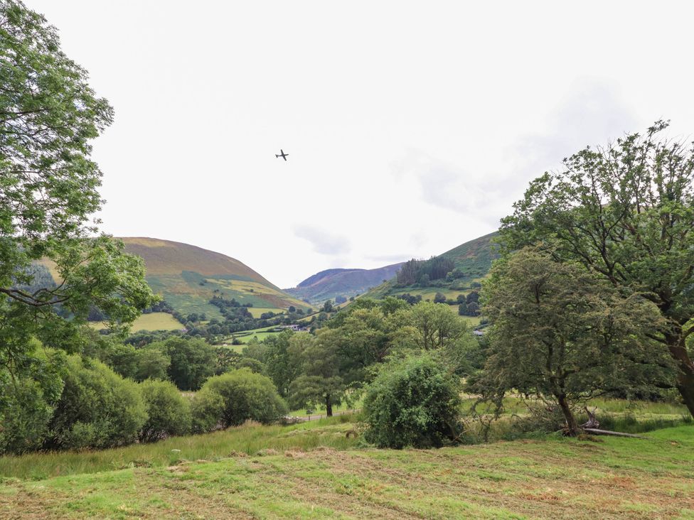 A landscape with hills and trees at Frondirion Dinas Mawddwy