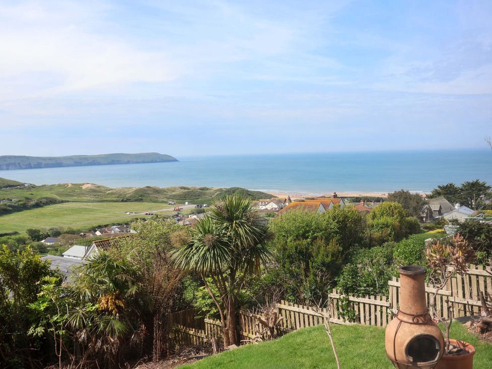 A coastal view with sea and hills at 15 Chichester Park
