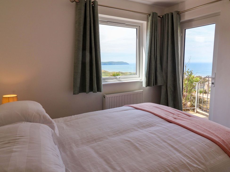 A bedroom with a view and a bed at 15 Chichester Park