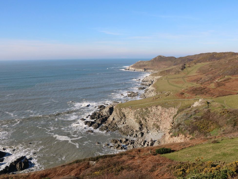 A coastal landscape with cliffs and ocean at 15 Chichester Park