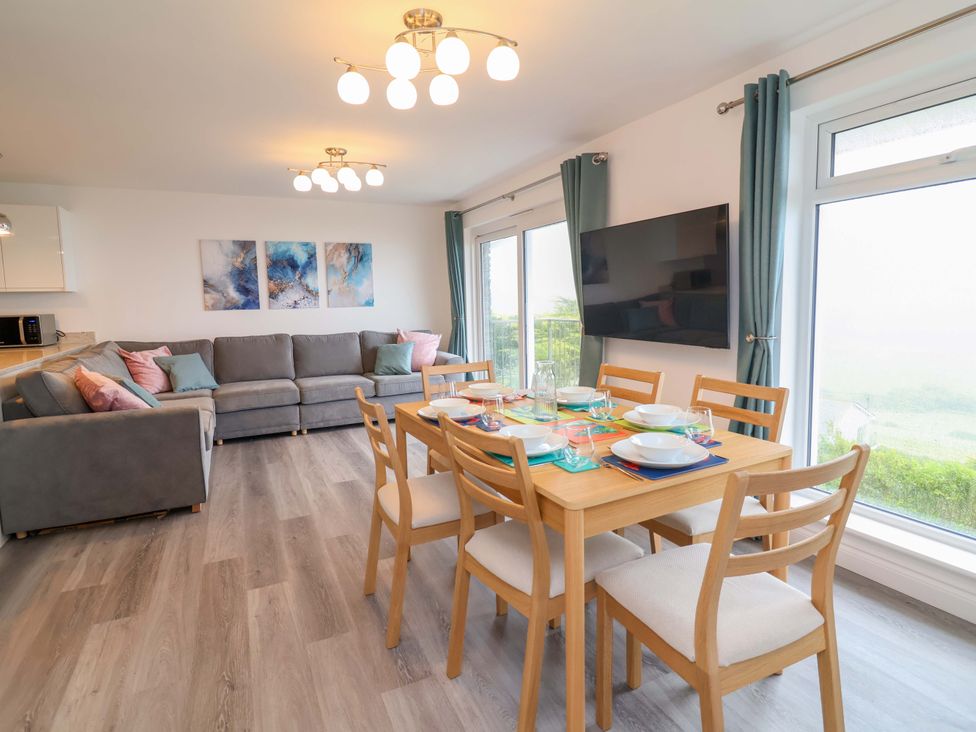 A living room and dining area with furniture at Belvedere in Woolacombe