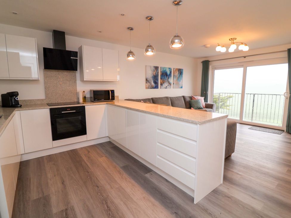 A kitchen with a countertop and appliances at Belvedere Woolacombe