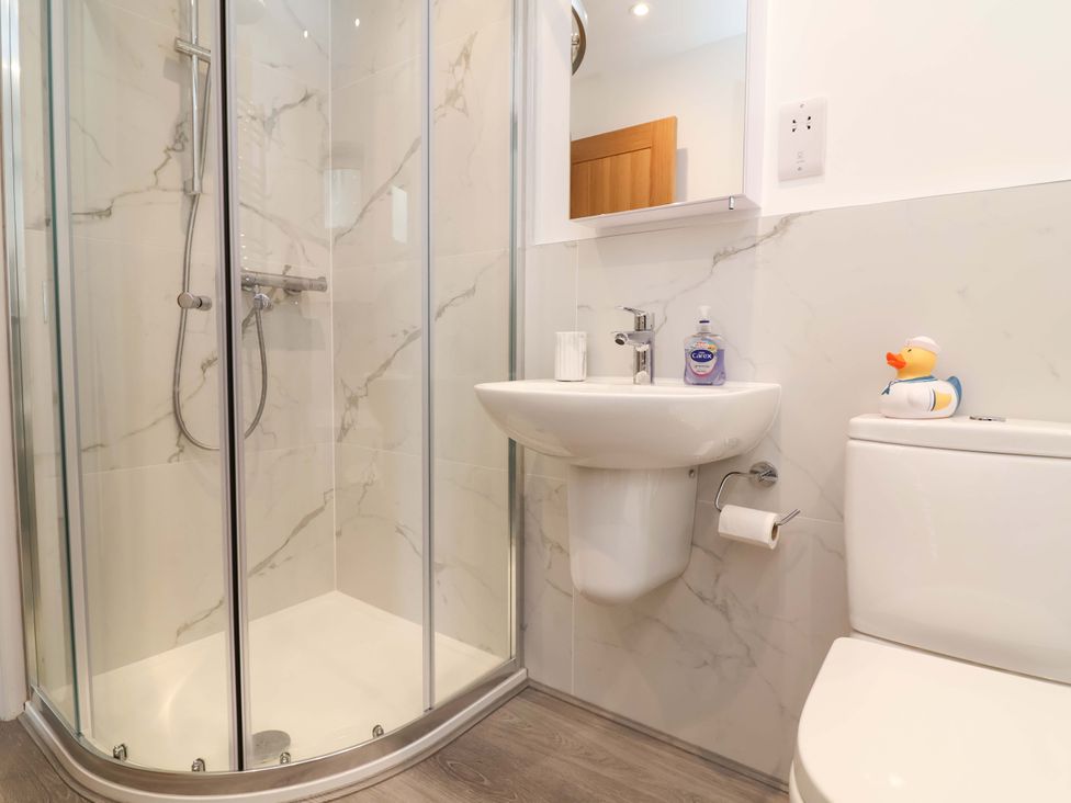 A bathroom with a shower and sink at Belvedere in Woolacombe