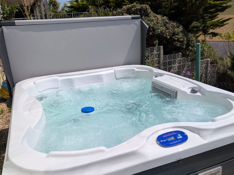 A hot tub with water and a control panel at Belvedere Woolacombe