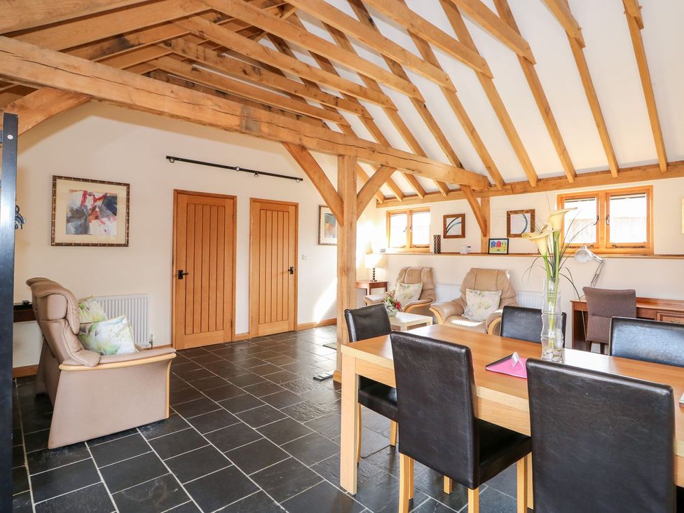 A living room with a dining area at 5b Hideaways in Hunstanton