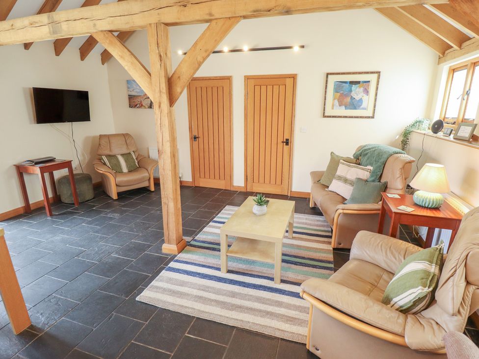 A living room with sofa and coffee table at 3b Hideaways in Hunstanton