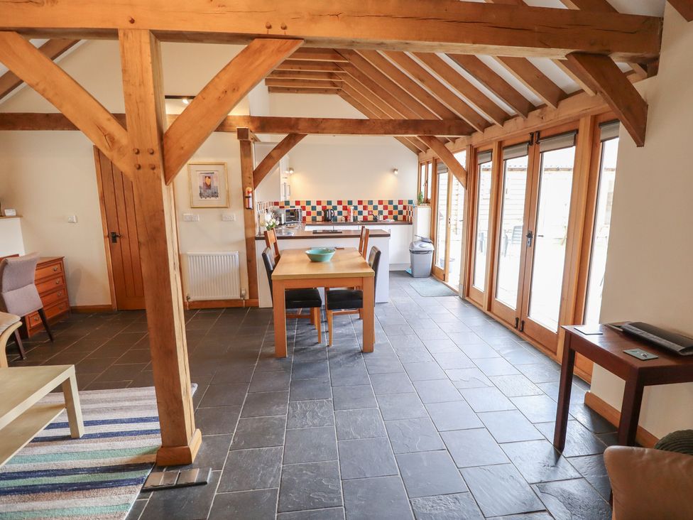 A kitchen with a dining table and chairs at 3b Hideaways in Hunstanton
