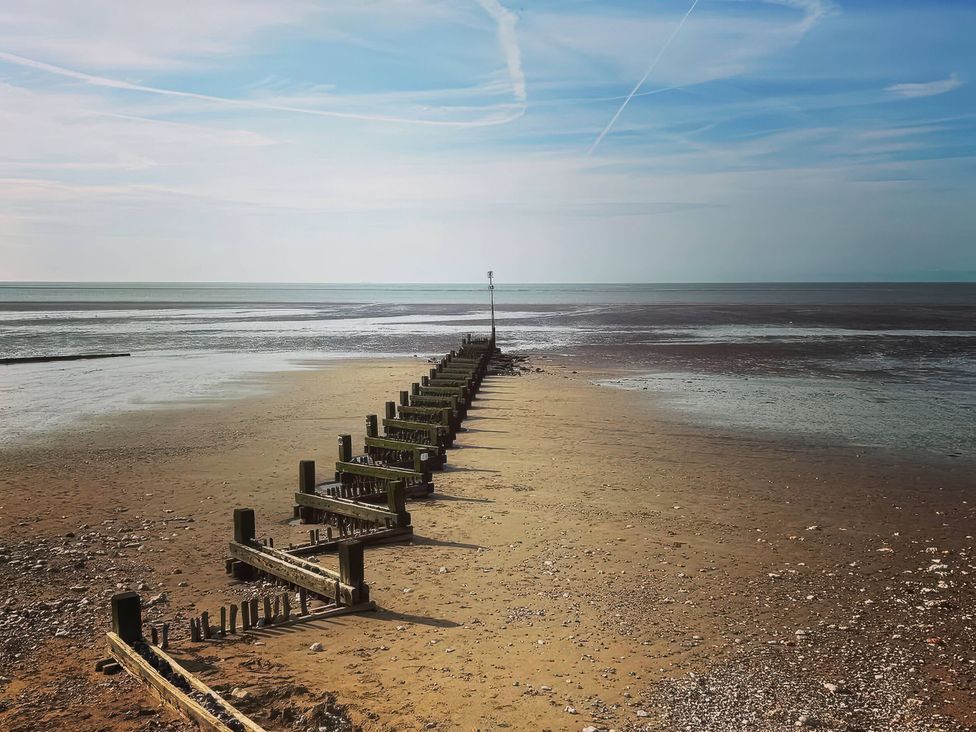 A groyne leading to the sea at 3b Hideaways in Hunstanton