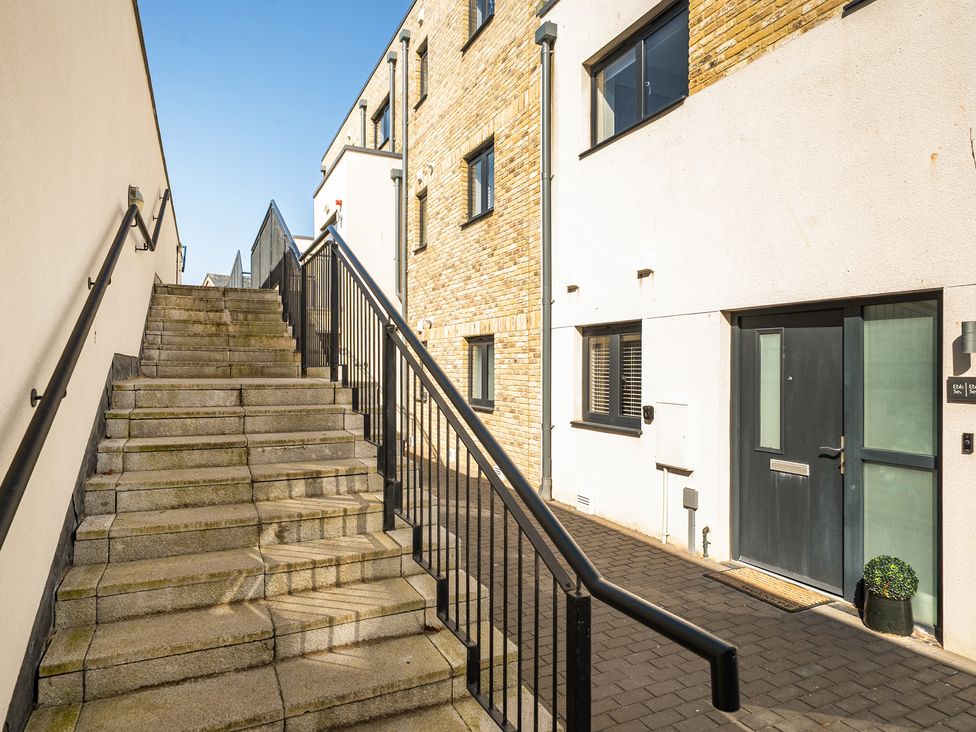 An exterior staircase leading to a doorway at Seascape in Newquay