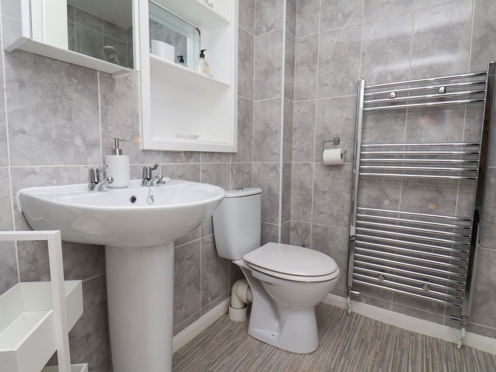 A bathroom with a sink and a toilet at Wheeldale Cottage Goathland