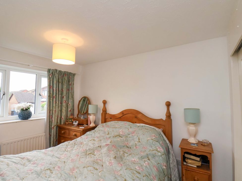 A bedroom with a bed and a bedside table at 7 Crestbrooke Northallerton