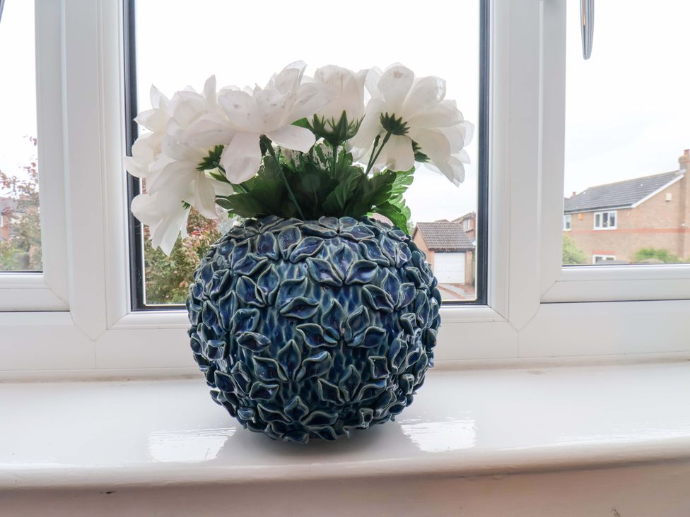 A vase with flowers on a windowsill at 7 Crestbrooke in Northallerton