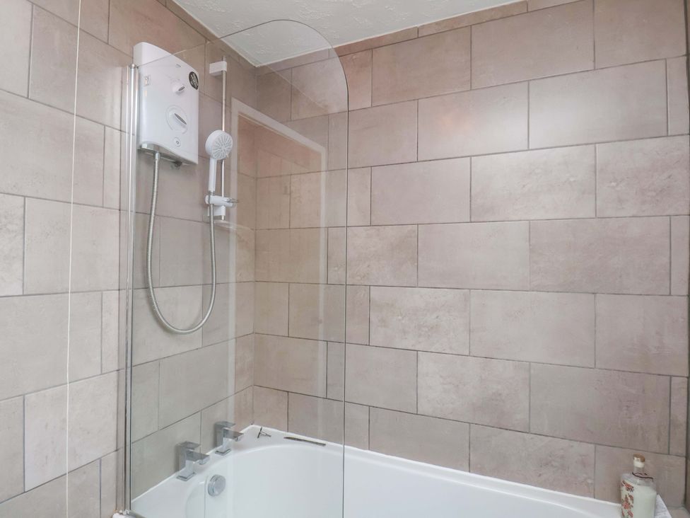 A bathroom with a shower and bath at 7 Crestbrooke in Northallerton