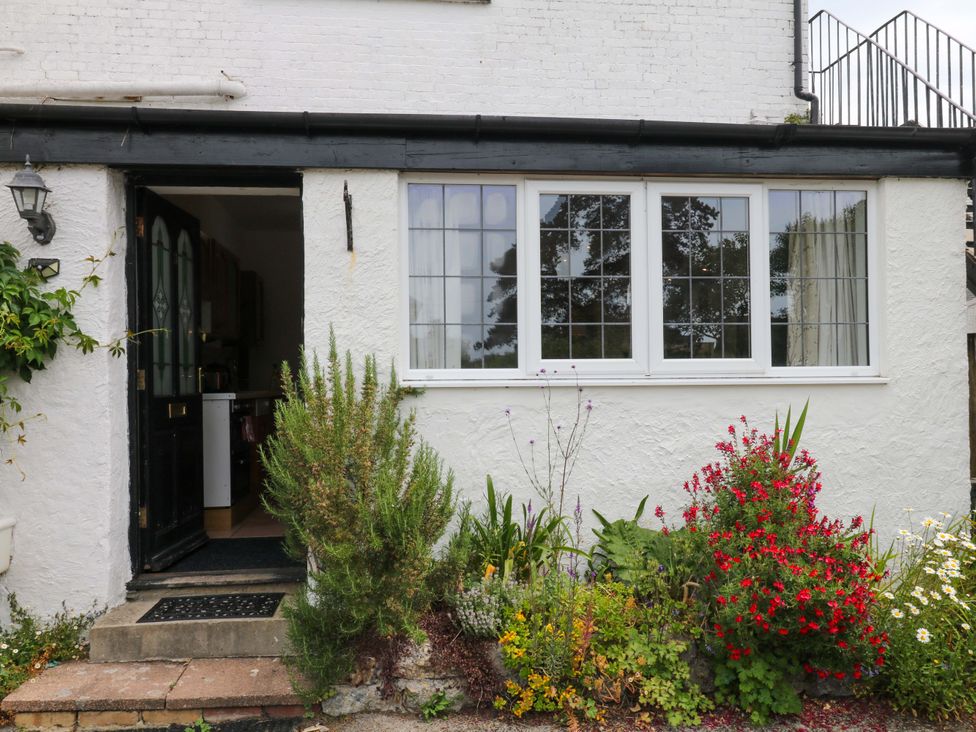 An entrance with a door and plants in front at The Headmasters Quarters in Chudleigh