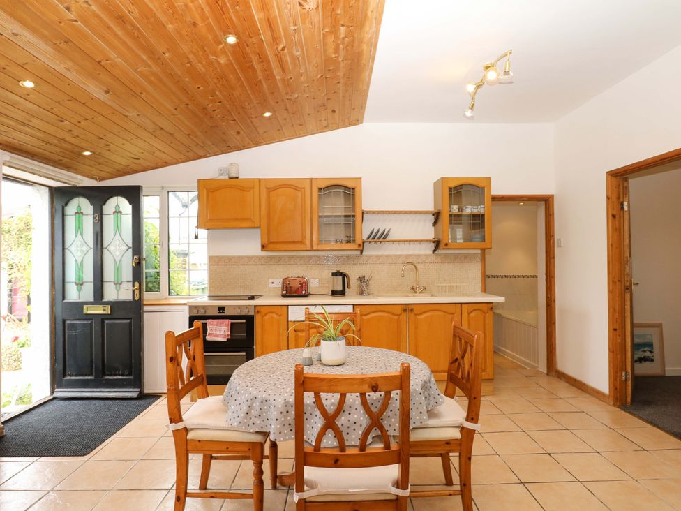 A kitchen with a table and chairs The Headmasters Quarters Chudleigh