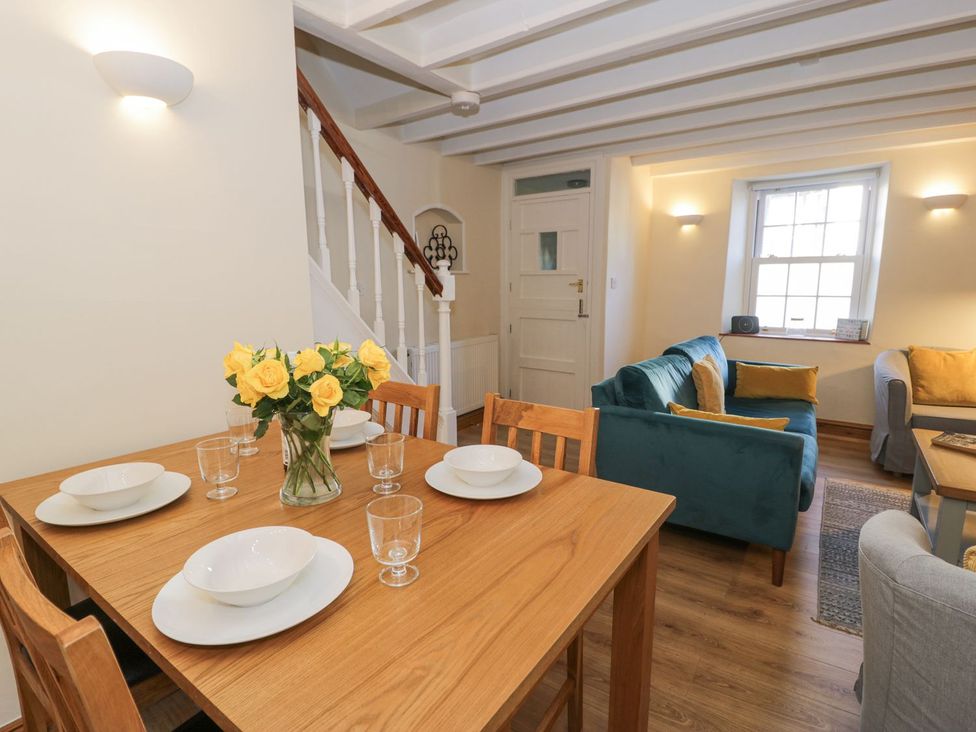 A dining room with a table and chairs at Ty Gwyn in Aberdovey