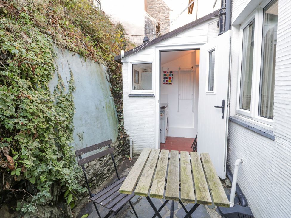 An outdoor area with a table and chairs at Ty Gwyn in Aberdovey