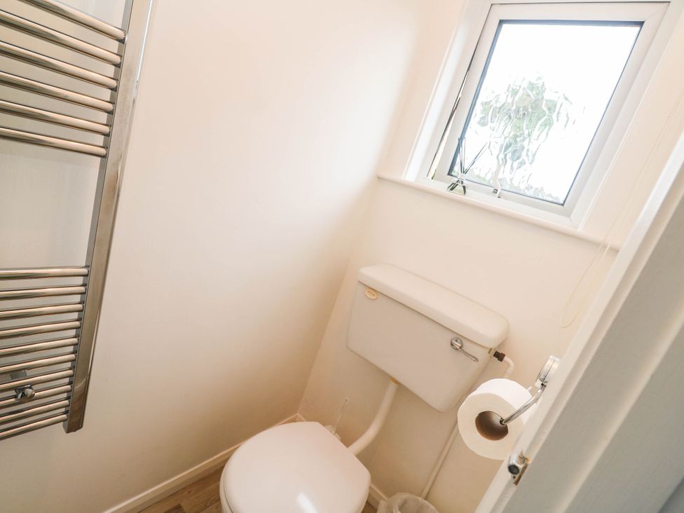 A bathroom with a toilet and a radiator at 8 Yellow Sands in Padstow