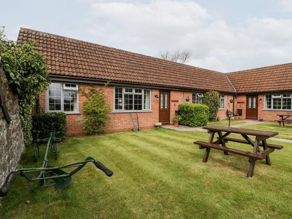 An outdoor area with a garden and seating at Oak Tree in Weston-super-Mare