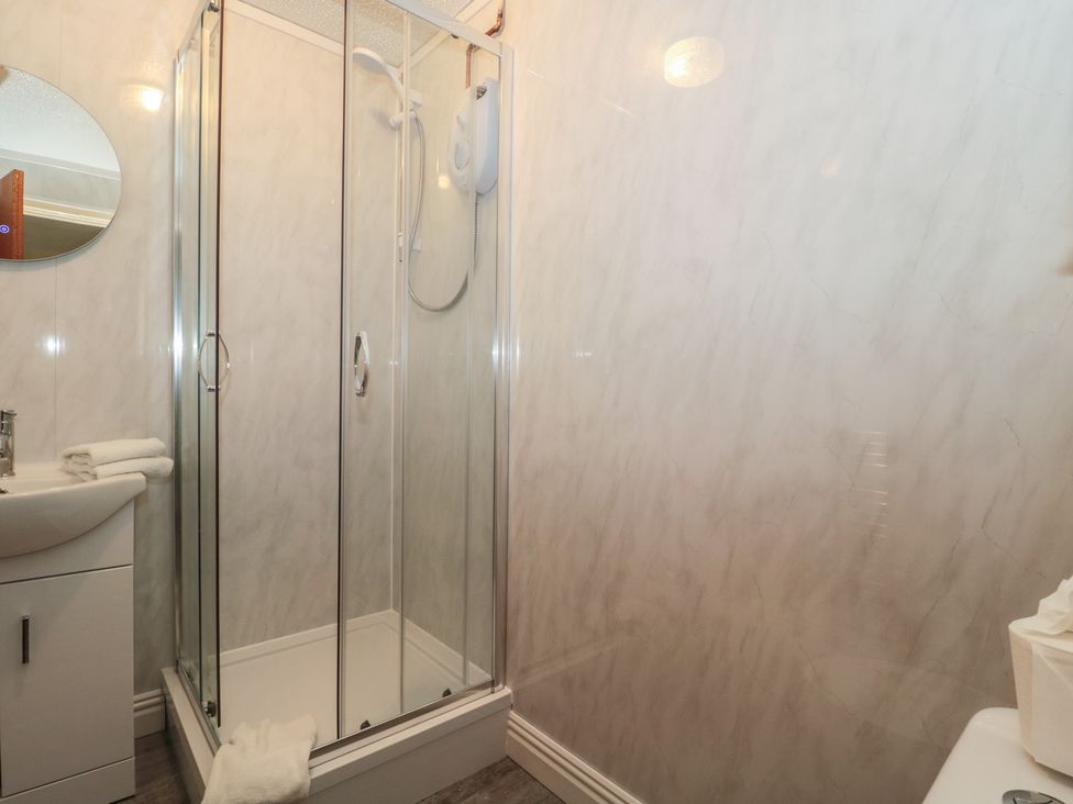 A bathroom with a shower and sink at Oak Tree in Brean