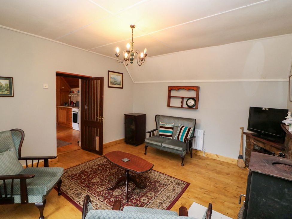 A living room with seating and a television at Gullane East in Rathmore, County Kerry