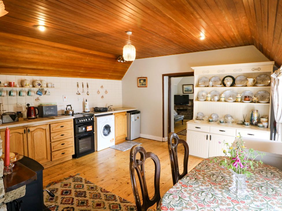 A kitchen with cabinets and appliances at Gullane East in Rathmore, County Kerry