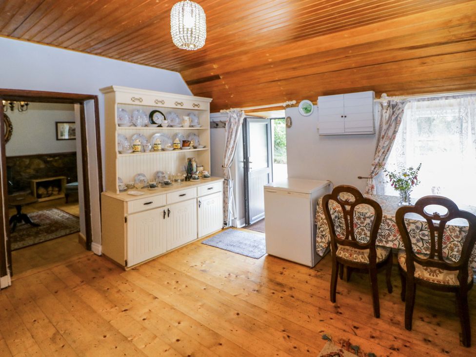 A dining room with a table and chairs at Gullane East, Rathmore, County Kerry