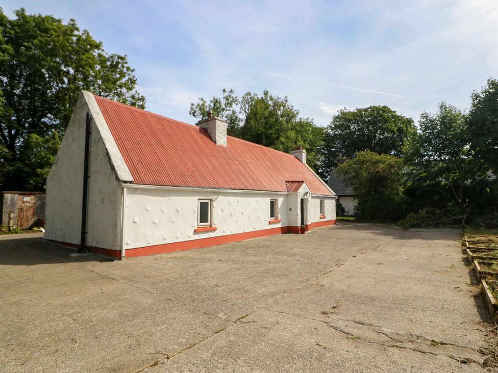 A house with a red roof and driveway at Gullane East in Rathmore, County Kerry