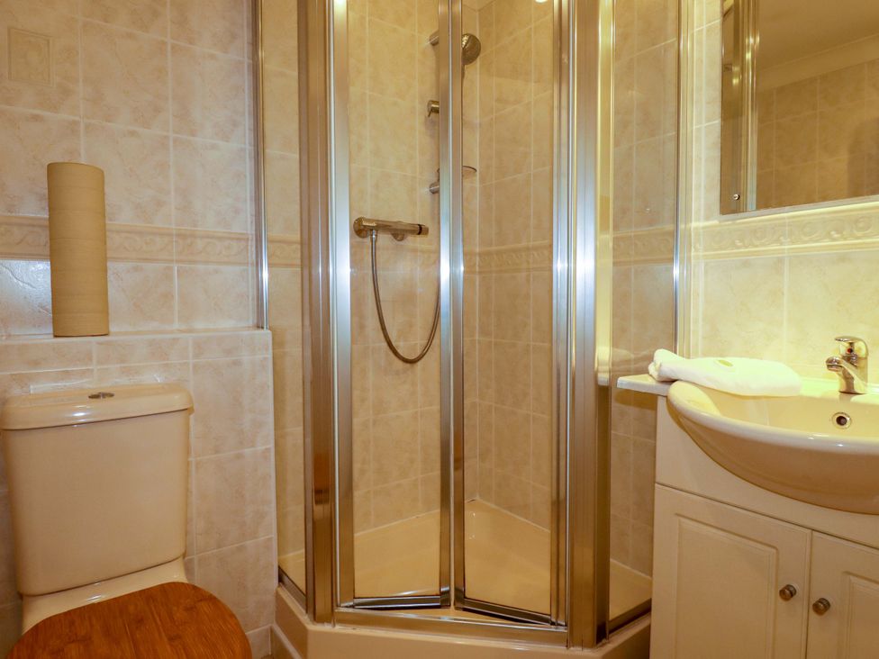 A shower and sink in a bathroom at 4 bed number 2 Atlantic Reach near St Columb Road