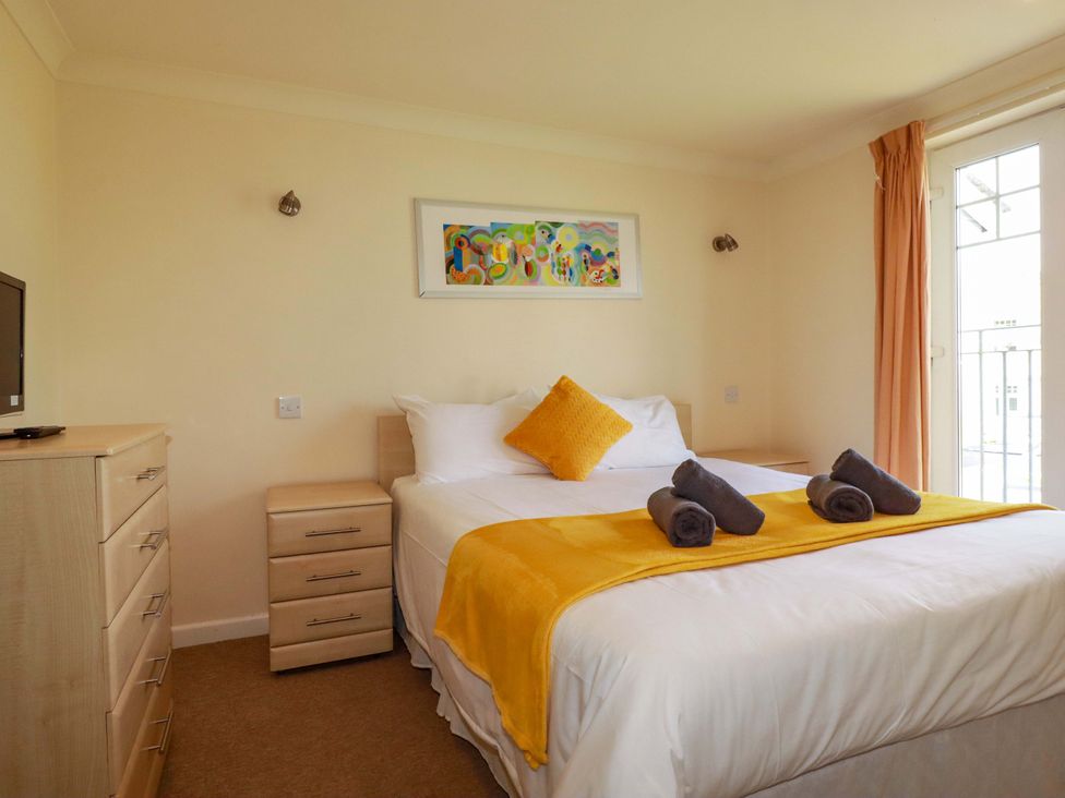 A bedroom with a bed and television at 4 bed number 2 Atlantic Reach near St Columb Road