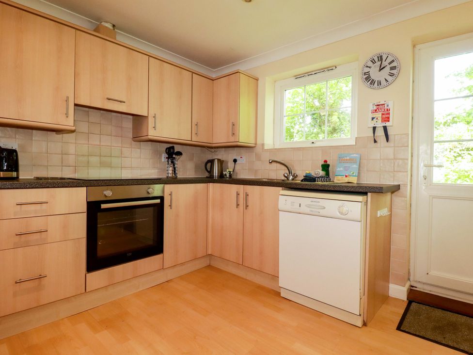 A kitchen with oven, sink, and dishwasher at 4 bed number 20 Newquay