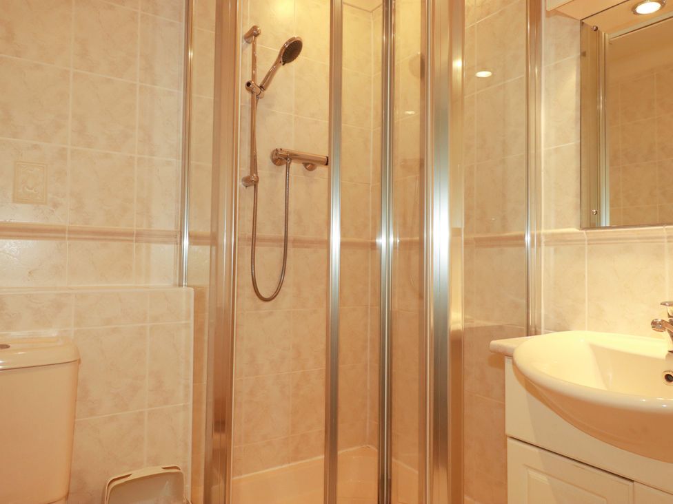 A bathroom with a shower and a sink at 4 bed number 20 in Newquay