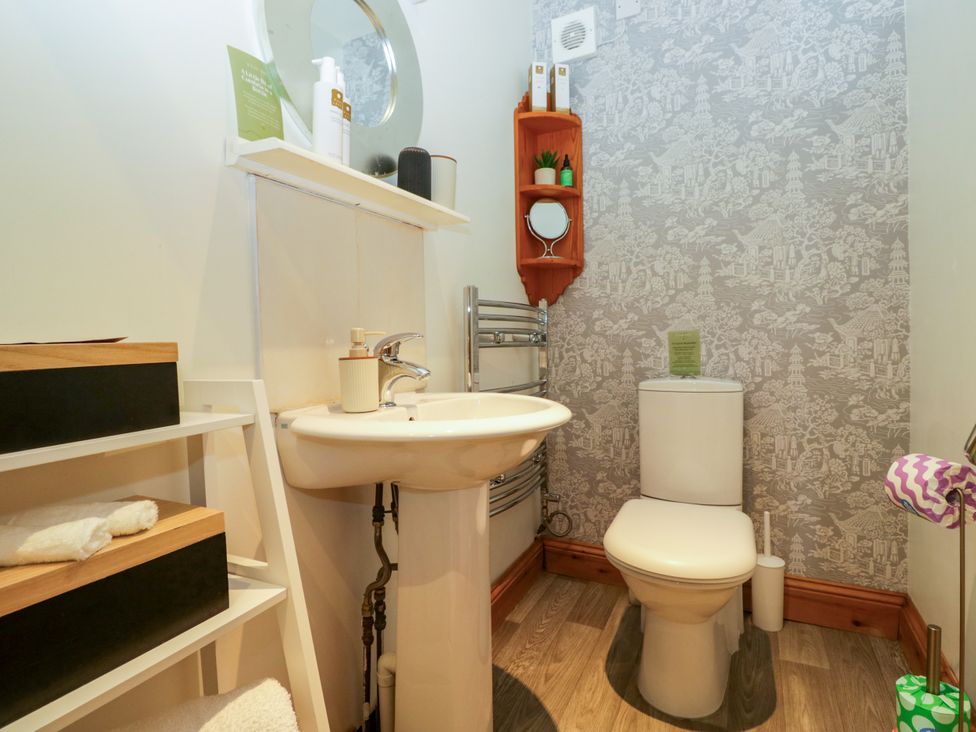 A bathroom with a sink and toilet at La'al Yan in Branthwaite