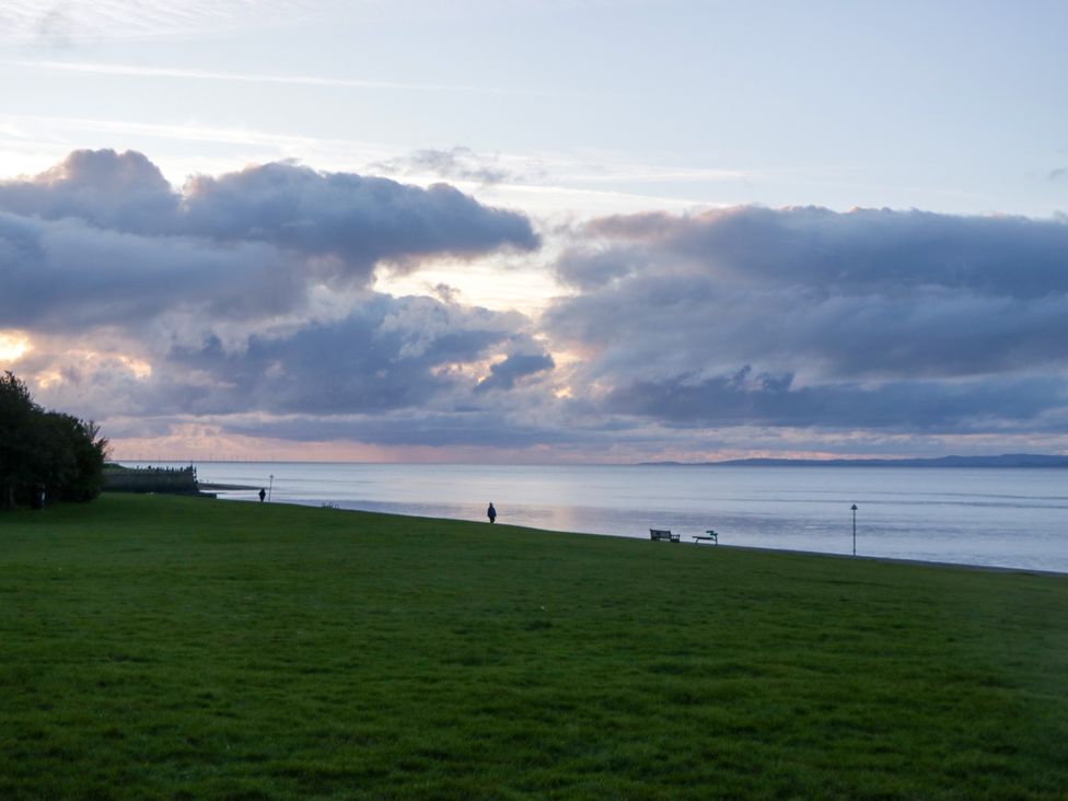 A view of grass and water with clouds at La'al Yan in Branthwaite